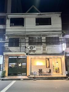 a building with a balcony on the side of it at Layover at 1146 in Manila