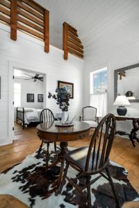 a living room with a table and chairs at Cedar Break at Howard Ranch in Driftwood
