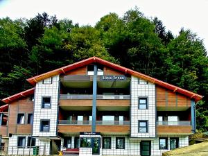 a large building with the words live taxes on it at Liva Teras Suites Uzungöl in Uzungöl