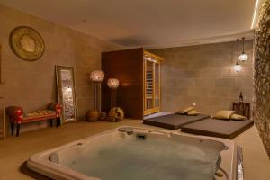 a large bath tub in a room with a bed at Casa Rabat in Rafelcofer +53 photos