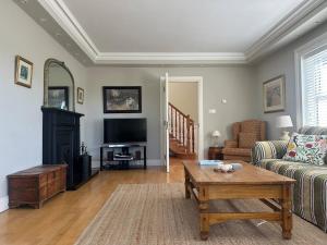 a living room with a couch and a coffee table at Grianán in Ballyconneely