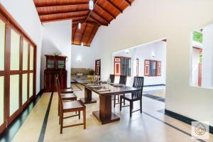 a dining room with a table and chairs at Wimala Sewana in Veyangoda