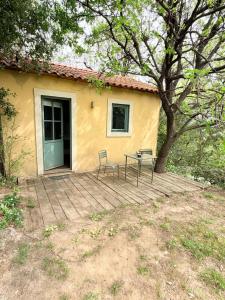 a house with two chairs and a table on a deck at Les Terrasses d'Héric in Mons
