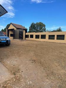 a car parked in front of a house at Villa Amari in Aliwal North