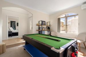 a living room with a pool table in it at Elysian Fields in Joondalup in Perth