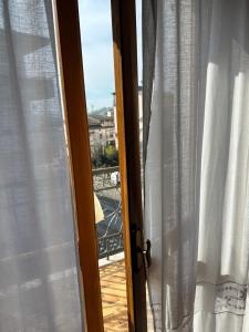 an open window with a view of a balcony at Antico Borgo in Tarsia