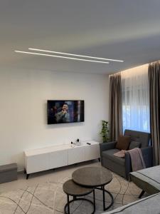 a living room with a couch and a table at Mel Apt in Golem