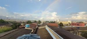 a view of a city with roofs and an umbrella at Residencial Hanna in Anápolis