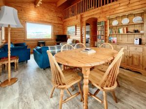 a dining room with a wooden table and chairs at Whiteburn in Pitlochry +12 photos