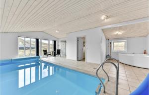 a large swimming pool with a tub and a sink at Nice Home In Hvide Sande With Sauna in Hvide Sande +25 photos