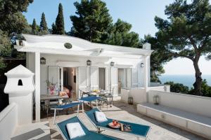 a villa with a view of the ocean at GOCCE VILLAS - Villa Bouganvillea Superb Capri Villa with Views in Capri