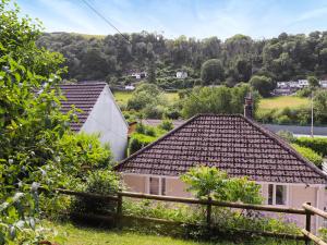 a view of a house with a roof at Brynhafod in Llanfihangel-geneuʼr-glyn