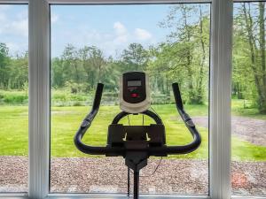 a computer chair sitting in front of a window at Eskside Lodge in Brechin +16 photos