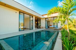 an image of a swimming pool in a villa at Casa Ariana in Ubud