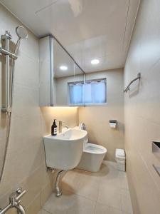 a bathroom with a sink and a toilet at Check in Seoul in Hongdae 2 in Seoul +73 photos