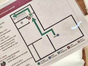 a detailed diagram of a hotel room on a menu at Check in Seoul in Hongdae 2 in Seoul