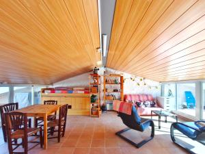 a dining room with a wooden table and chairs at Amplia Casa en Vinaixa, calle Mayor, Cal Mitger in Viñaixa