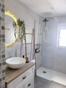 a bathroom with a white sink and a shower at La Luz in Zuheros +30 photos