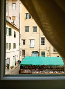 a view of a building from a window at Madame Pucci in Lucca