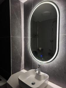 a bathroom with a sink and a mirror at Maison du nook in Hanoi +4 photos
