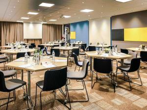 a conference room with tables and chairs in it at Ibis Rabat Agdal in Rabat