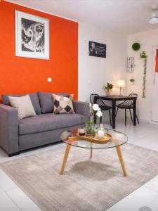 a living room with a couch and a table at Dreamy Oasis in Marigot