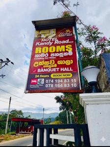 a sign for a koreanoreanorean restaurant with prices on it at Hotel Kandy road in Meda-Ela