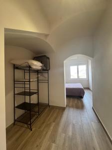 a room with a bed and bunk beds in it at El niu del volcà in Olot