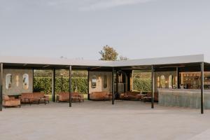 a pavilion with chairs and a bar in a building at Relais San Giorgio in Pignataro Maggiore