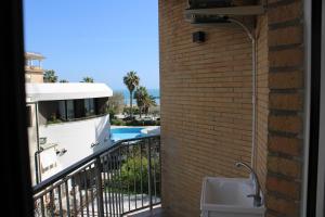 a view from the balcony of a building with a pool at Perla dell'Adriatico in San Benedetto del Tronto