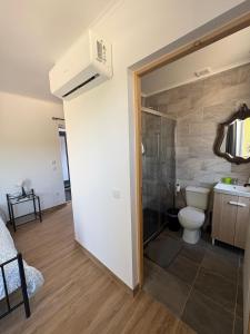 a bathroom with a toilet and a sink at Ribeirinha in Lousã +56 photos