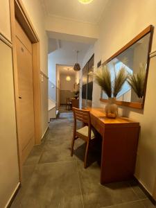 a dining room with a table and a mirror at Australia in Skiathos