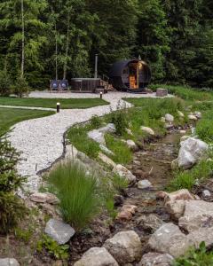 a cabin in the woods next to a stream at Sosnowy Szept in Karpacz