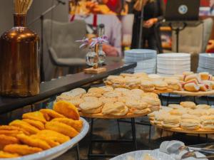 a buffet of cookies and other pastries on plates at ibis Copiapo in Copiapó