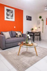 a living room with a couch and a table at Dreamy Oasis in Marigot