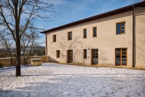 a building with snow in front of it at Otegui Etxea Casa Rural in Aspuru
