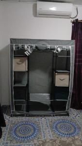 a room with a glass table with drawers at Les Jasmins partagées in Mamoudzou