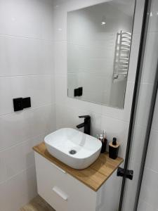 a white bathroom with a sink and a shower at Tleniowo in Tleń +47 photos