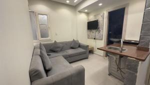 a living room with a couch and a sink at Egy property in 6th Of October