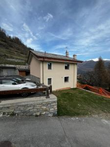 a car parked in front of a house at Lo Boneur in Torgnon