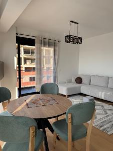 a living room with a table and chairs and a couch at Dolce dimora in Bar