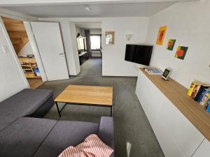 a living room with a couch and a table at Ferienhaus Welling in Welling