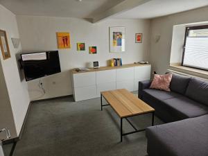 a living room with a couch and a table at Ferienhaus Welling in Welling