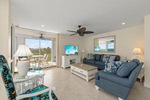 a living room with a couch and a table at Island Beach Club #360D in Sanibel