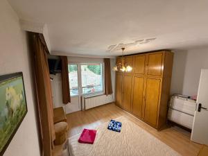 a living room with two bags on the floor at Къща Ники in Stoykite +7 photos