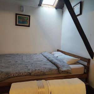a bedroom with two beds and a window at Historical House in Alsancak in Konak