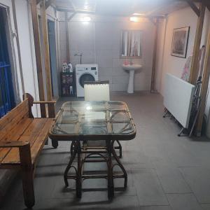 a room with a table and a bench and a sink at Historical House in Alsancak in Konak +53 photos