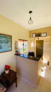 a kitchen with a counter top in a room at Apartamentos PraiaMar in Ilha Comprida
