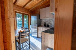 a kitchen with a counter and a refrigerator at Zabes Home in Zabes +21 photos