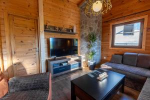 a living room with a couch and a tv at Zabes Home in Zabes